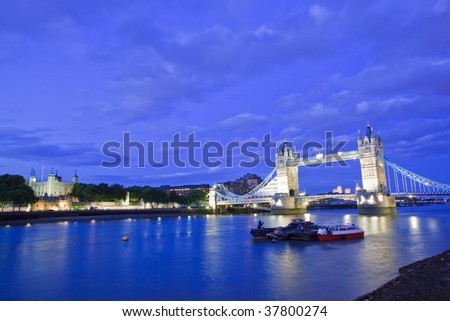 View of the Tower Bridge and Tower of London at dusk.