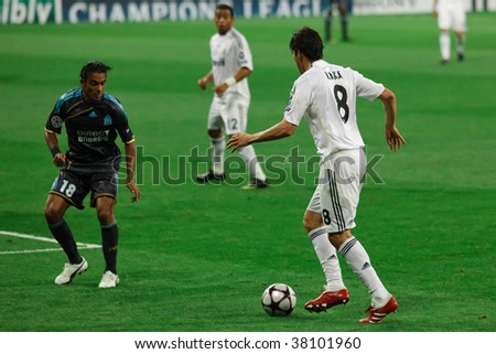 MADRID - SEPT 30 : Kaka of Real Madrid approaches defender Fabrice Abriel at Real Madrid\'s 3-0 victory over Olympique Marseille in Champions League group stage action September 30, 2009 in Madrid