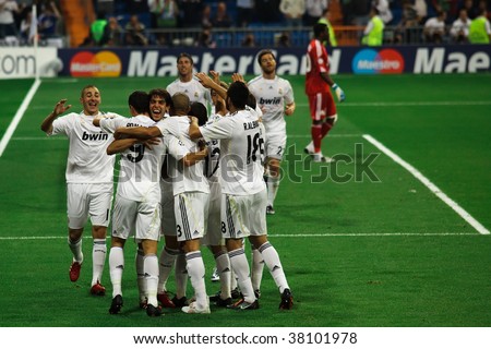 MADRID- SEPT 30: Real Madrid players celebrate Cristiano Ronaldo\'s third goal during Real Madrid\'s 3-0 win over Olympique Marseille in Champions League group stage action September 30, 2009 in Madrid