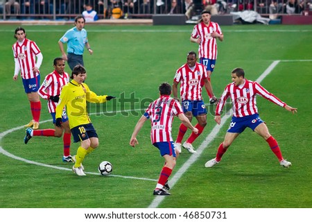 MADRID - FEB. 14 : Barcelona player Lionel Messi (4th L) tries to dribble through the defense during Atletico Madrid's 2-1 victory over FC Barcelona February 14, 2010 in Madrid, Spain.