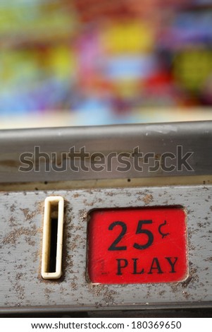 Coin slot with label 25 cents per play