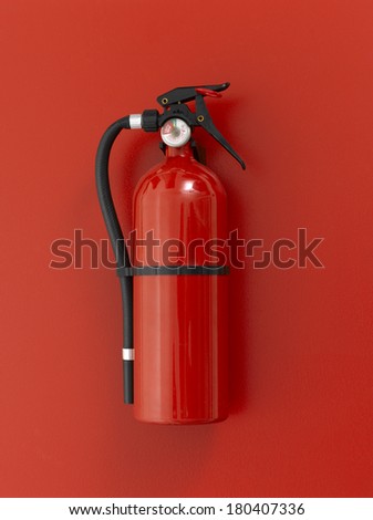 Red fire extinguisher on red background