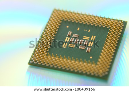 Computer CPU processor chip on green reflective background