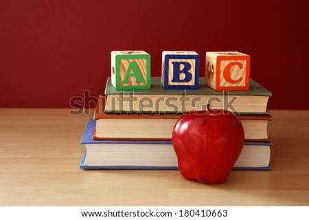Concept of education with ABC blocks, books and apple