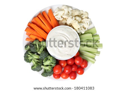 Vegetable platter with cauliflower, celery, tomatoes, broccoli, carrot sticks and ranch dip