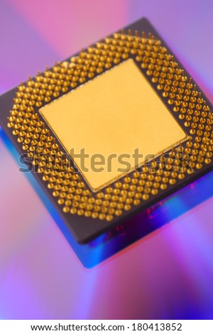 Computer cpu processor chip on purple dvd background