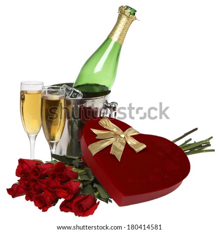 Valentine\'s day still life with heart shaped chocolate box, champagne bottle, glasses, and doze roses