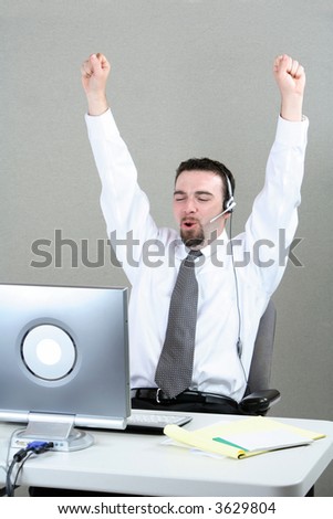 Businessman celebrating with hands in air