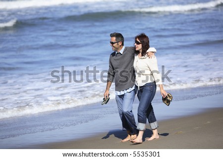 stock photo : Couple walking together on beach