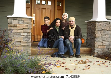 Family portrait sitting on porch