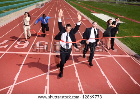 Businesspeople crossing the finish line