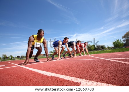 Track runners in starting position
