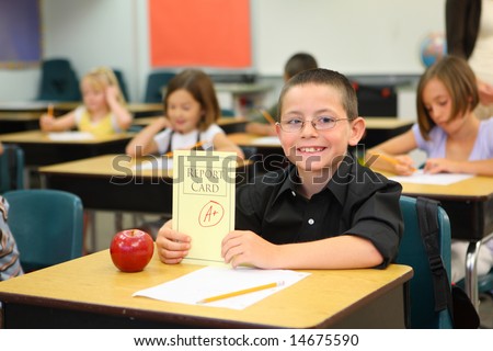 Elementary school student with A+ report card