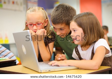stock photo : Elementary school students looking at computer