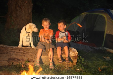 Children roasting hot dogs