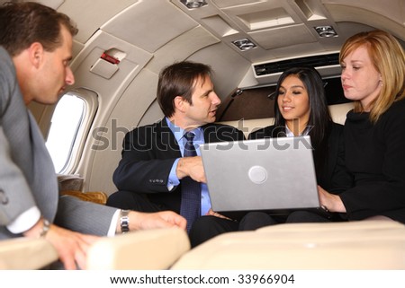 Group of businesspeople meeting in private jet