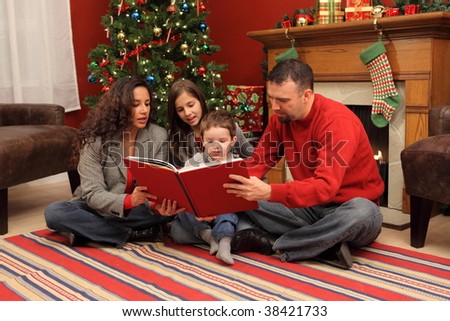 Family reading Christmas book together