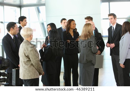 Crowd of businesspeople in lobby