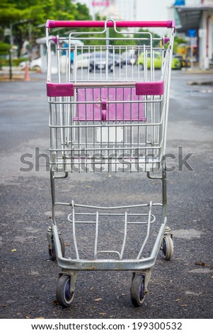 Shopping cart at supermarket parking lot