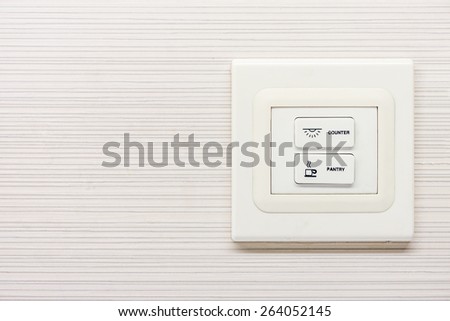 Electrical switch buttons on wall for controlling circuits
