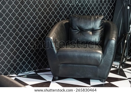 Black leather sofa in studio room