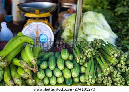 Eggplants (Solanum melongena), cucumbers (Cucumis sativus) and raw roselles (Hibiscus sabdariffa) are vegetables for retail sale in Thailand fresh food market