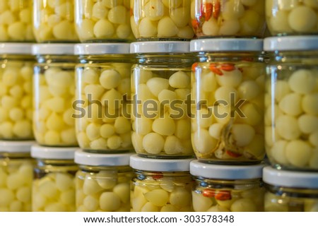 Pickled elephant garlic packed in glass jar for sale in Thailand food market