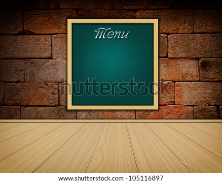 Menu on grunge green chalkboard and old brick wall background