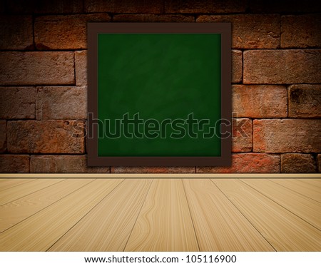 grunge green chalkboard on old brick wall background  and wood floor