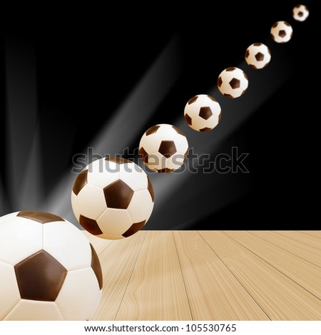 Soccer Ball on wood floor with abstract black and light background
