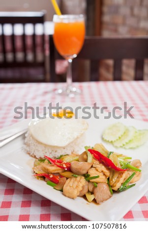 sunny-side up egg on rice with spicy fried vegetable and tofu,Thai menu