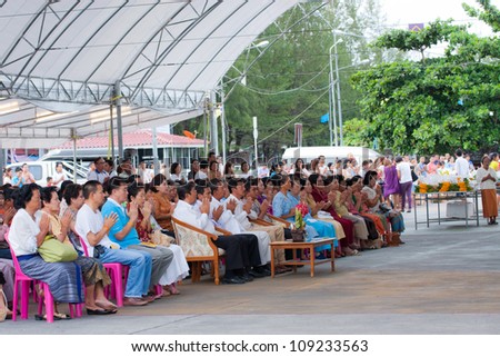 KO SAMUI, THAILAND - AUGUST 3 Unidentified the buddhists pray  to monks in The Buddhist Lent Day on August 3,2012 Samui island,Thailand