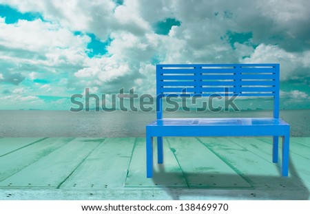 Blue chair and seascape background
