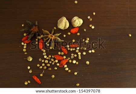 Herbs and spices aromatic ingredients  natural food additives on grunge wooden board