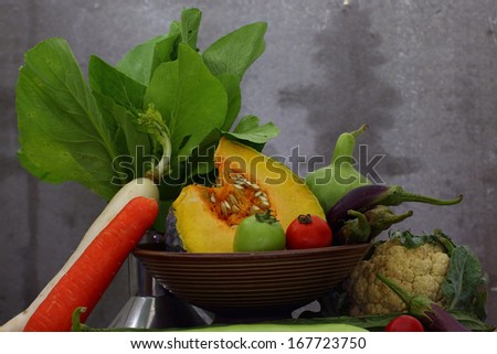Still life harvested vegetables agricultural  on wooden background