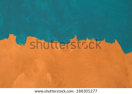 Green painted brush texture on orange cement wall background