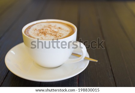 coffee cup on wood black table
