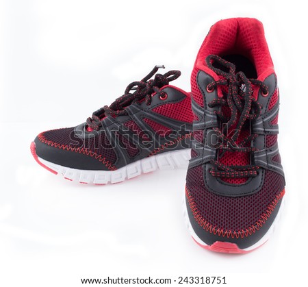 Red sports shoes on white background