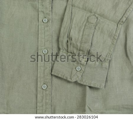 Close up new green linen shirt isolated on white background