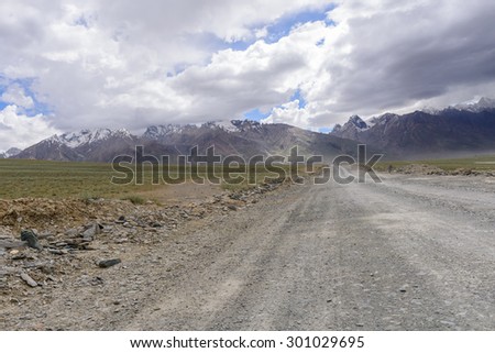 Road in Zanskar landscape view with Himalaya mountains covered with snow and blue sky in Jammu & Kashmir, India,