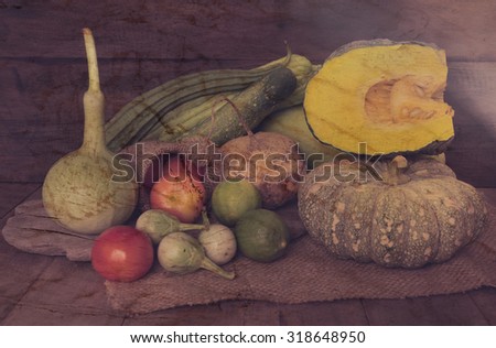 Still life harvested vegetables agricultural on wooden background,retro effect