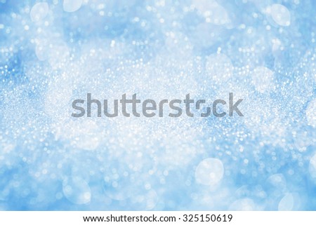 Abstract silver light on blue blurred background