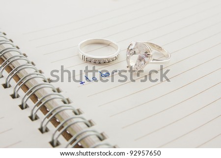 open notebook with wording to do and diamond ring...love concept