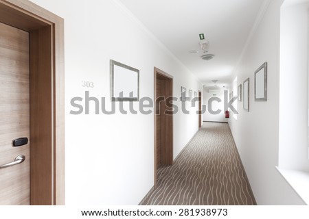 hotel hallway with many doors