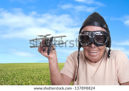 Funny old woman with a pilots hat and goggles