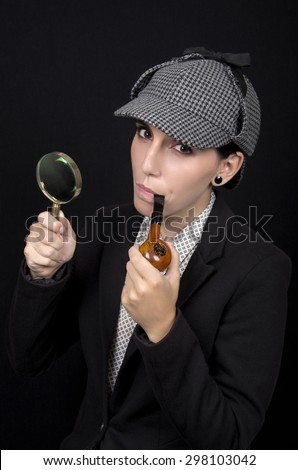Woman as Sherlock Holmes following tracks with magnifying glass