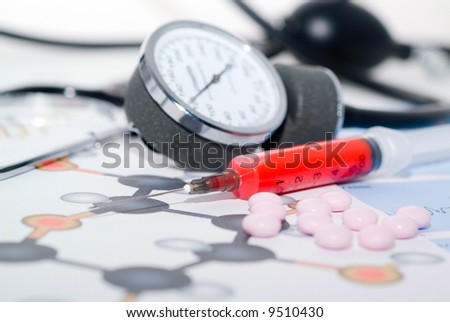 Tablets on a background of medical diagrams