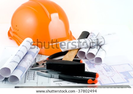 Yellow hard hat and working tools