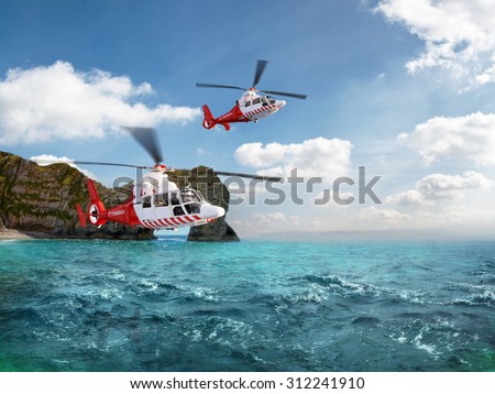 Two red rescue helicopter flying in blue sky above the sea