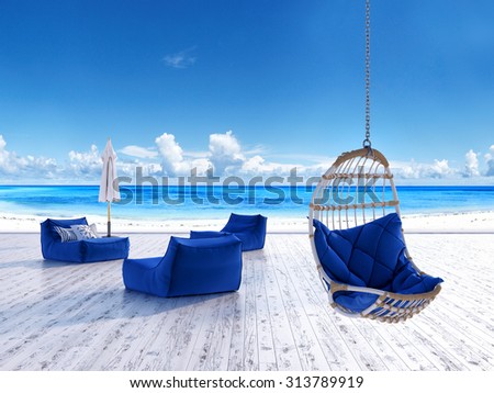 Beach lounge deck with sunbeds umbrella and hanging chair with sea view